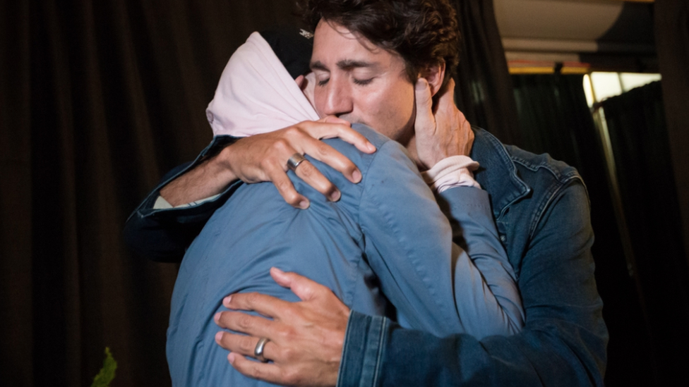 Prime Minister Justin Trudeau embraces Gord Downie before The Tragically Hip's show in Kingston, Ontario