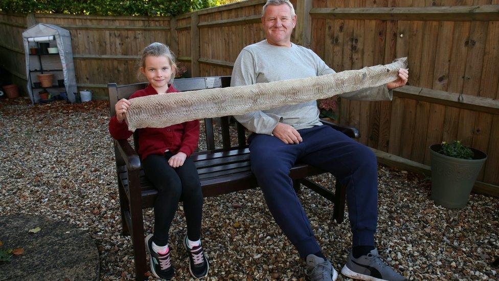 Girl and granfather with snake skin