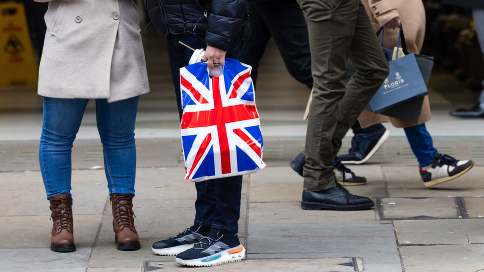 Shoppers on a UK high street in December