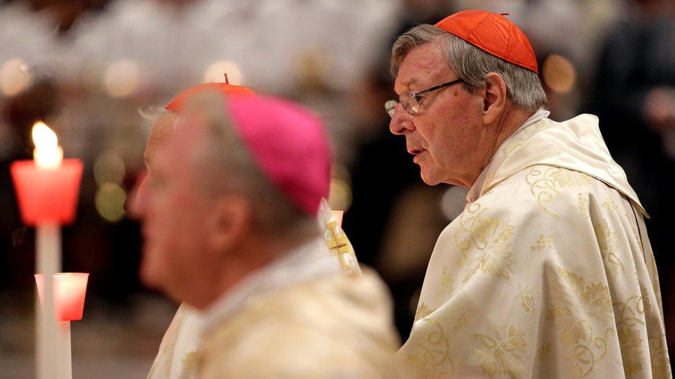 George Pell (right) at an Easter vigil mass in St Peter's Basilica at the Vatican in April 2017