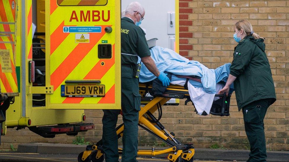 Patient being unloaded from ambulance at Southend University Hospital