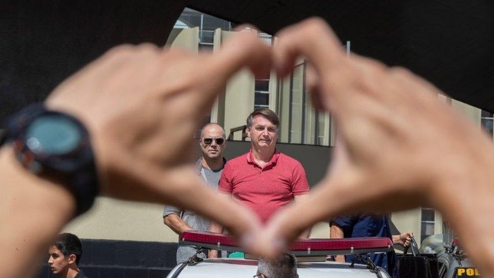 Brazilian President Jair Bolsonaro speaks to supporters during a rally in Brasilia, Brazil, 19 April 2020