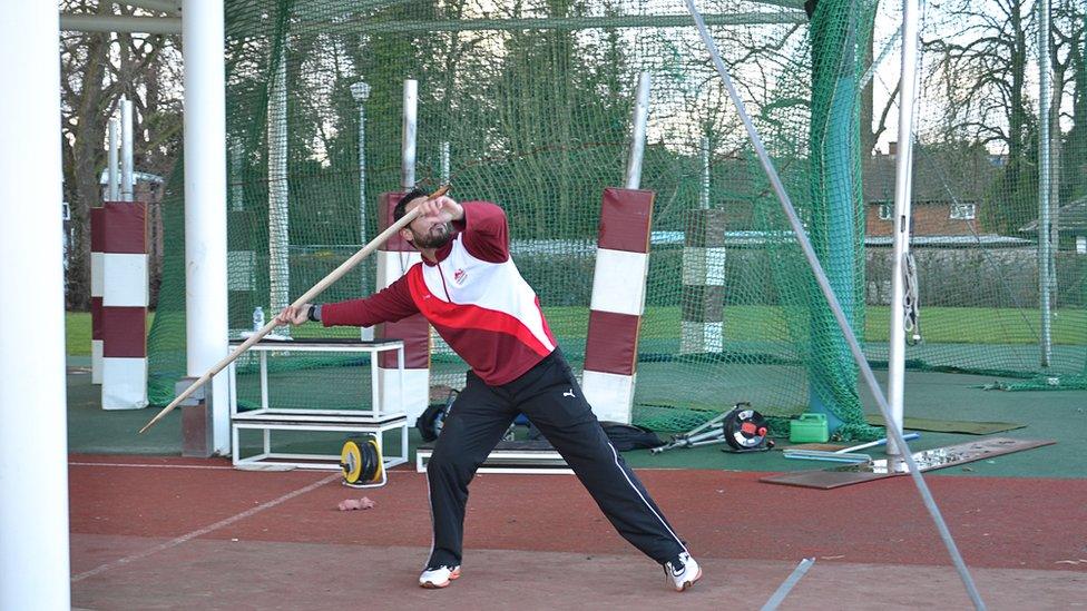 Athlete throwing spear