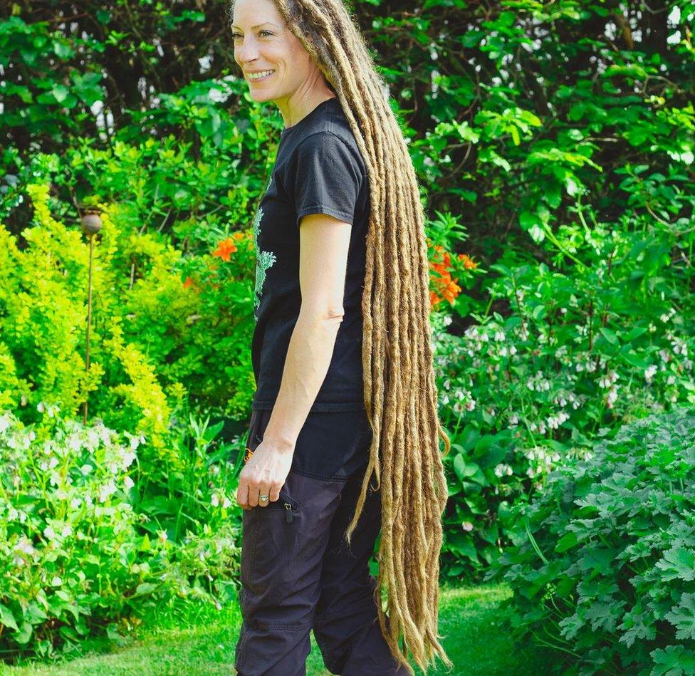 Jessica showing her knee-length dreadlocks