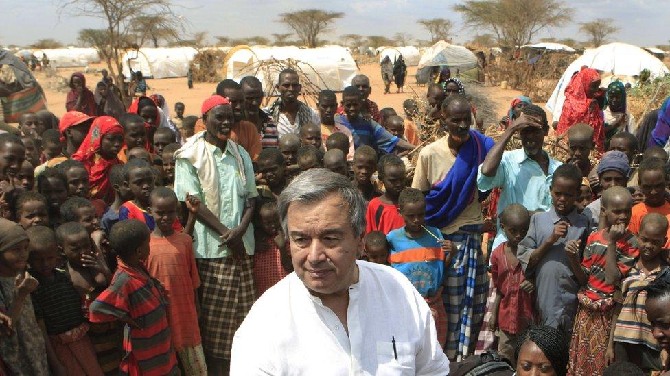 Antonio Guterres, as UN High Commissioner for Refugees, is surrounded by Somali refugees on the outskirts of Dagahaley camp, outside Dadaab, Kenya. July 10, 2011