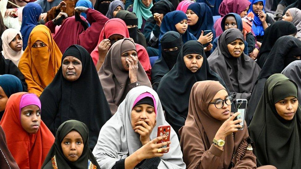 Women in Nairobi listening to an imam