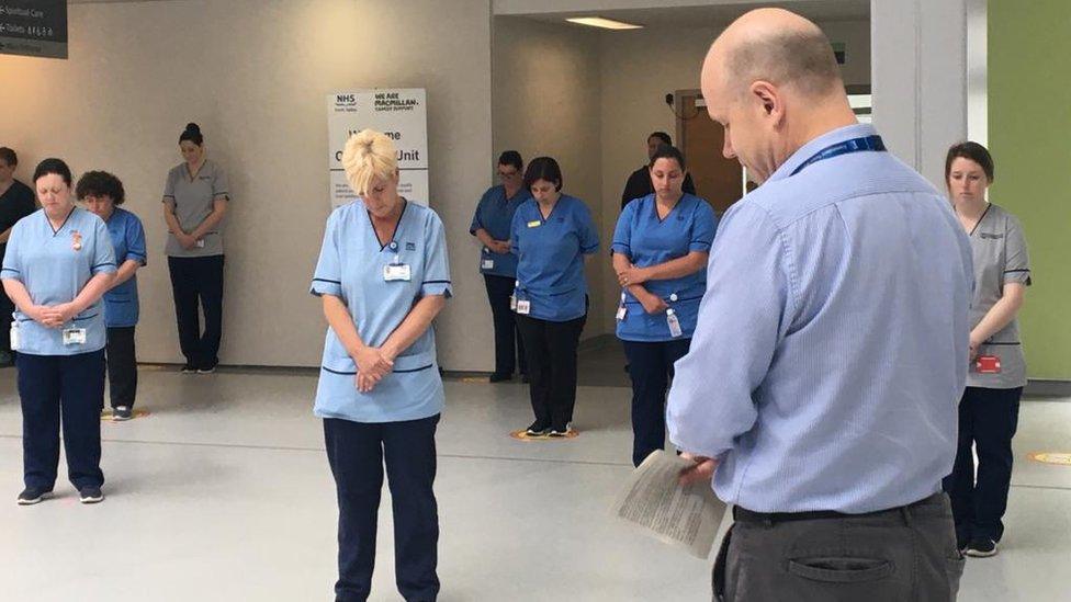 Tim Bennison, head of spiritual care, at Forth Valley Royal in Larbert leads NHS staff in a minute's silence