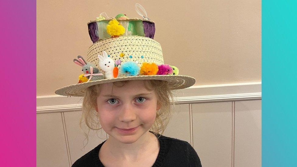 Girl in Easter bonnet.