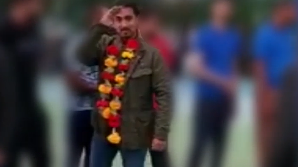 Tariq Khan saluting to the camera