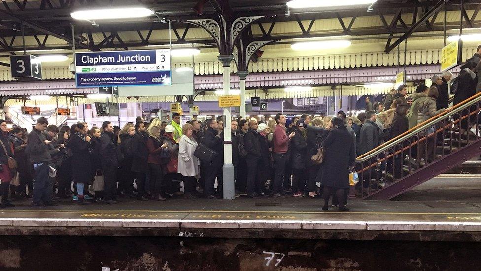 Commuters on a packed platform at Clapham Junction