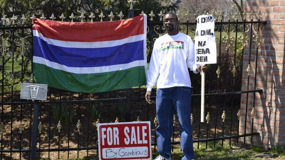 Man with a Gambian flag