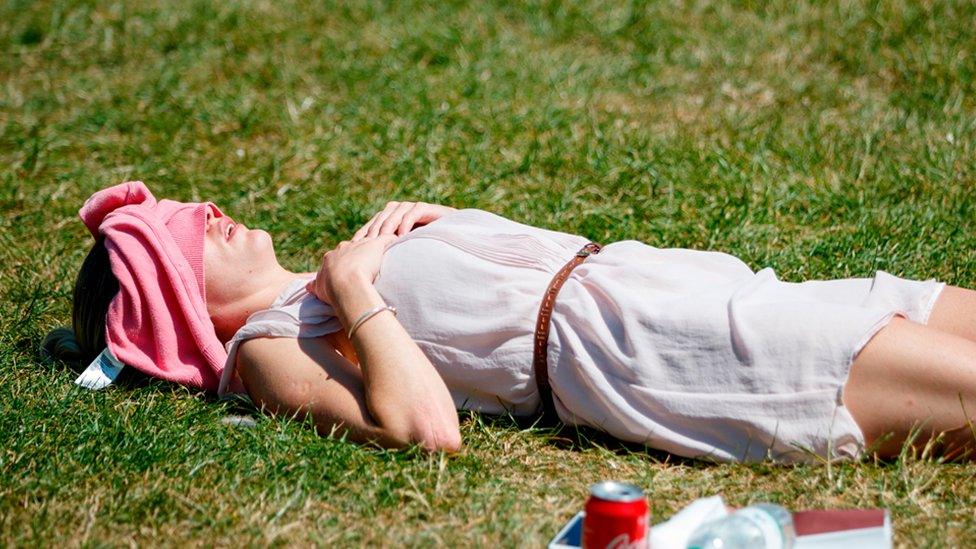 A woman lying in the sunshine