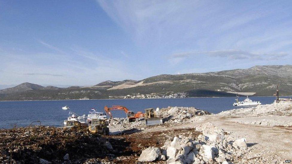 Diggers working at the site next to the Adriatic