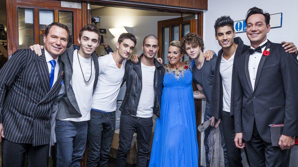 Jay pictured with his band and Strictly contestants from a previous show