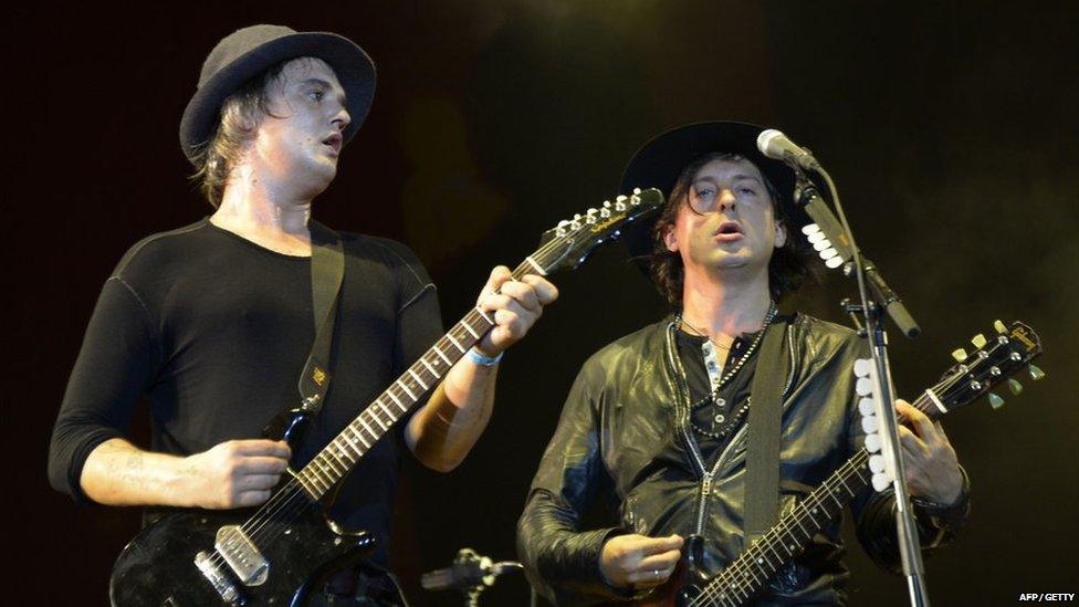 Pete Doherty and Carl Barat perform on stage