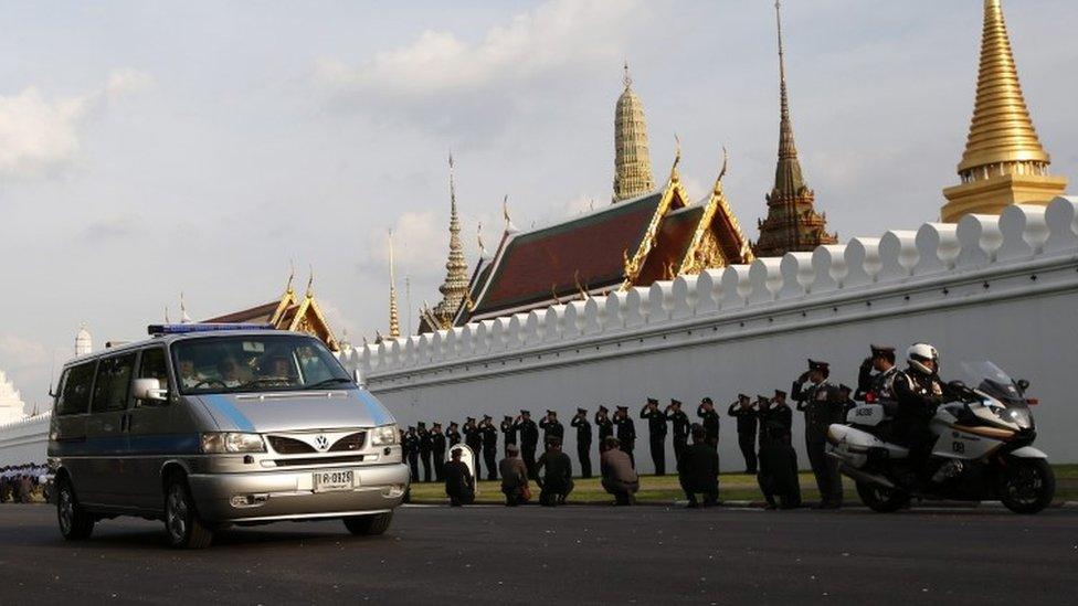 A convoy of vehicles carries the body of the Thai king