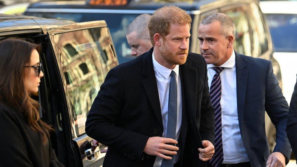 Prince Harrying getting out of a car as he arrives at the High Court last month