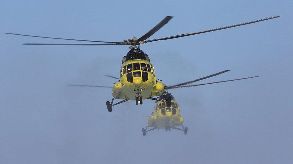 Handout photo showing two MI-8 helicopters belonging to Utair