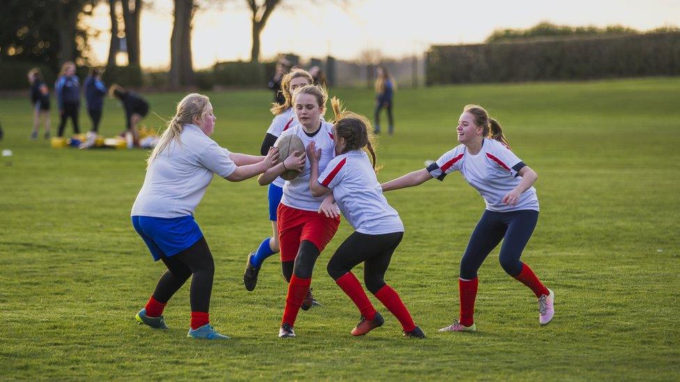 Girls playing rugby