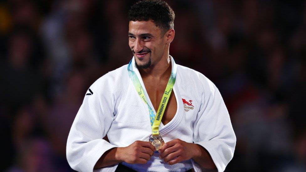 Gold Medalist Ashley Mckenzie of Team England celebrates during the Men's - 60 kg Medal Ceremony.