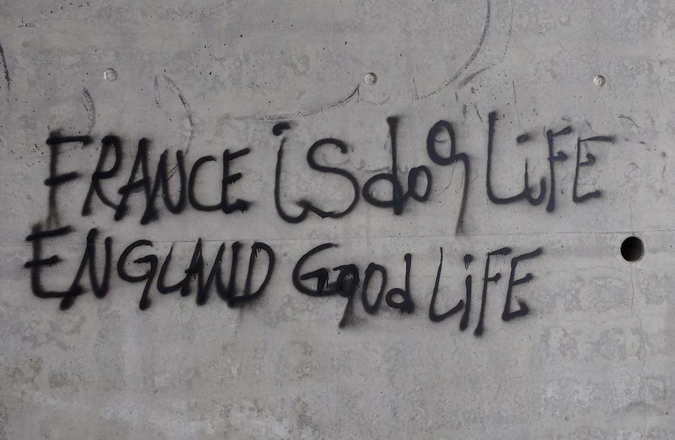 Graffiti reading: "France is dog life (sic), England good life"