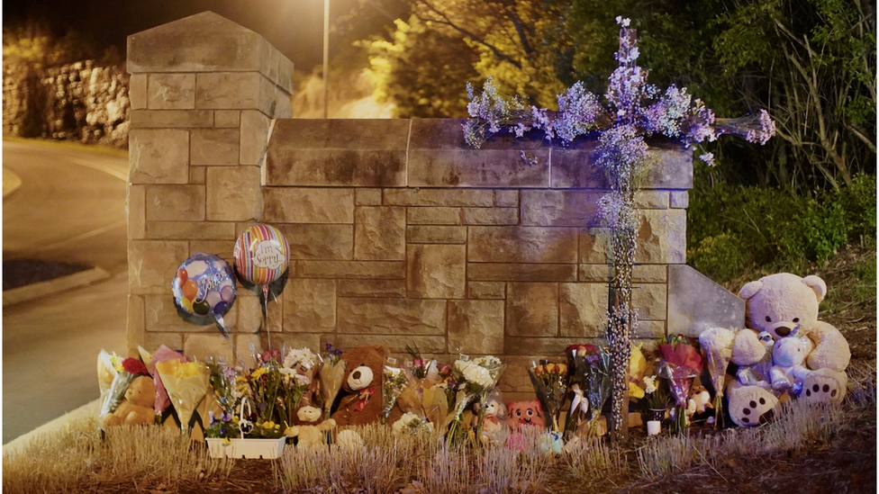 A growing memorial outside the school