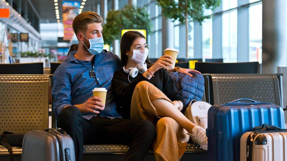 Couple waiting at airport (stock image)