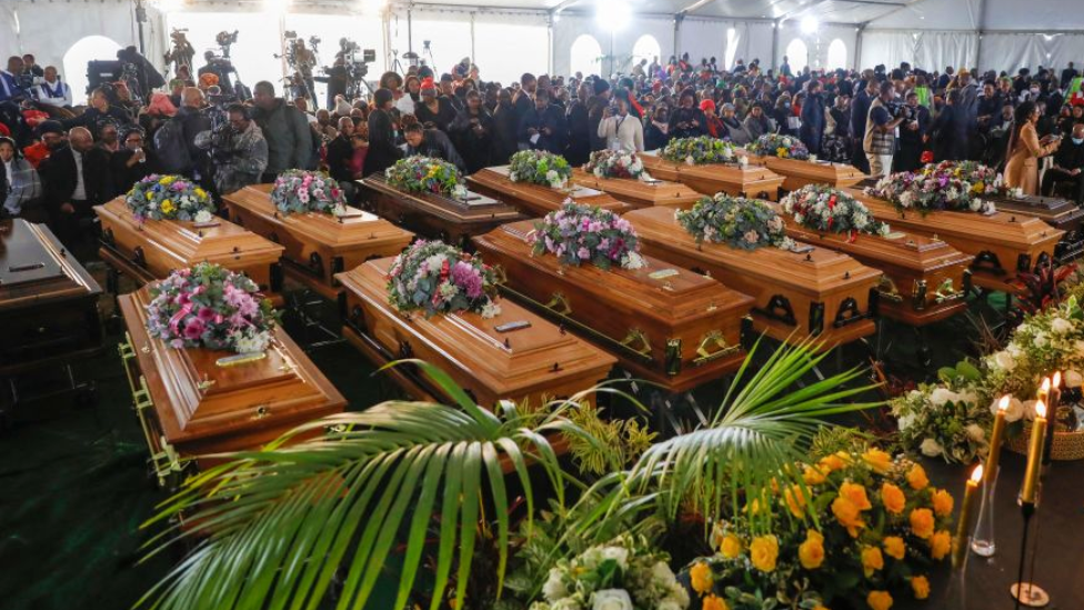 Coffins in the marquee at the funeral in East London, South Africa - 6 July 2022