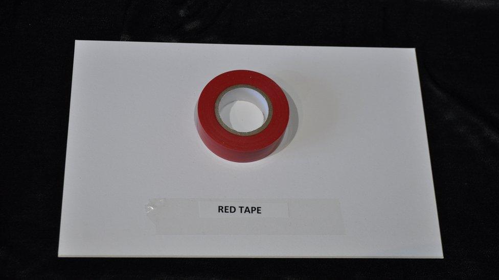 A reel of red insulation tape