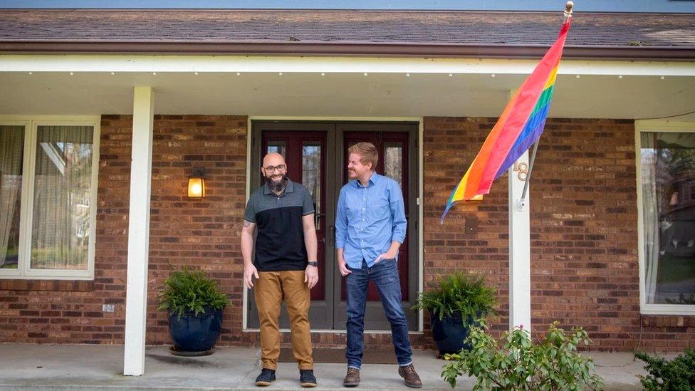 The couple with the original rainbow flag