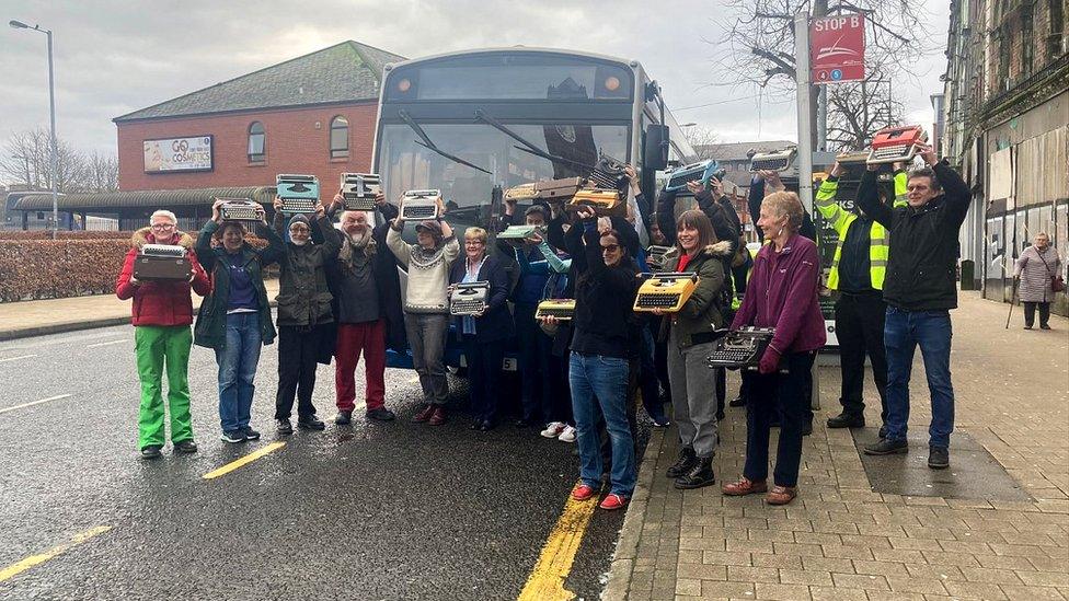 Translink bus and volunteers