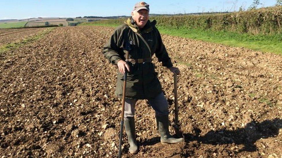 Brian Reed with his detector in a field