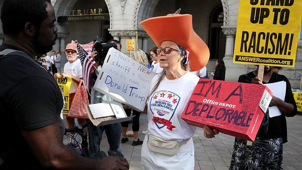 Trump-supporter Kelley Finn talks to anti-Trump protestors outside the Trump hotel.