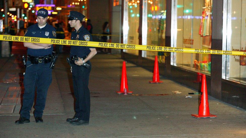 Picture showing New York Policemen outside a crime scene