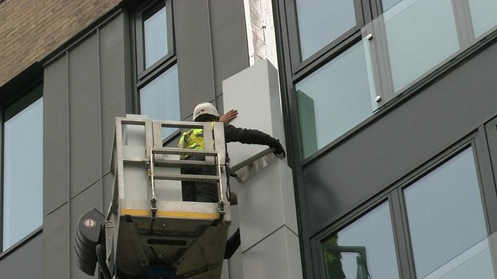 cladding being removed