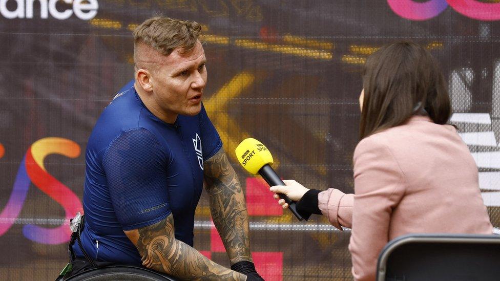 England's David Weir being interviewed after finishing third in the men's wheelchair race