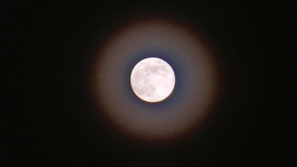 Moon surrounded by a corona captured in more detail with a ghostly ethereal quality