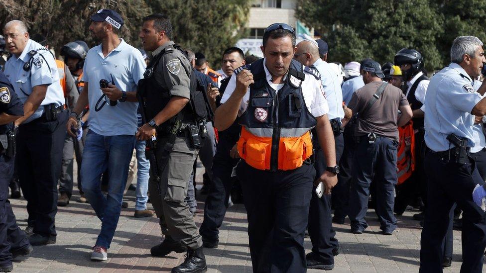 Israeli emergency services personnel at the scene of a stabbing attack in Jerusalem's Ammunition Hill district (12 October 2015)