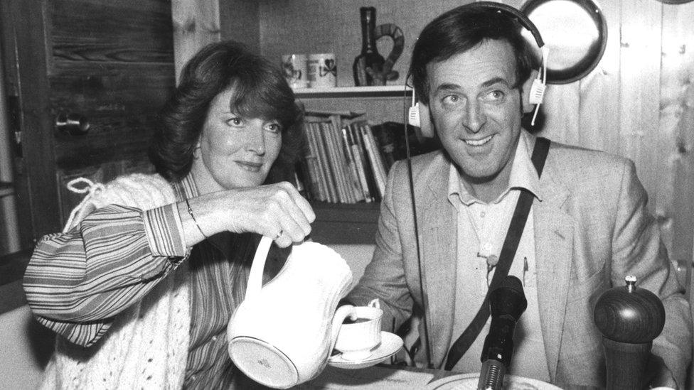 Sir Terry Wogan, with his wife Helen, broadcasting his BBC Radio 2 show live from his home in 1980