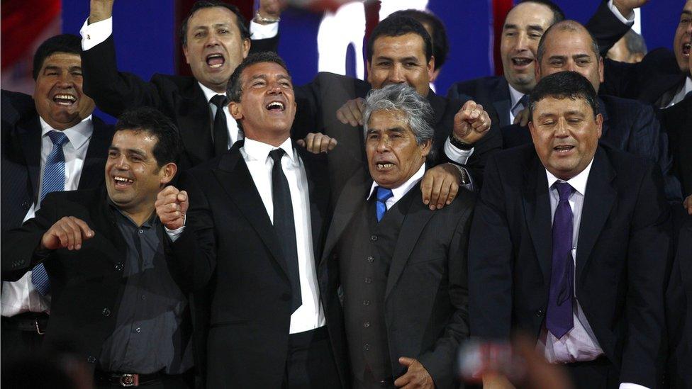 Antonio Banderas pictured with Chilean miners who were trapped in Copiapo at the preview of The 33 film