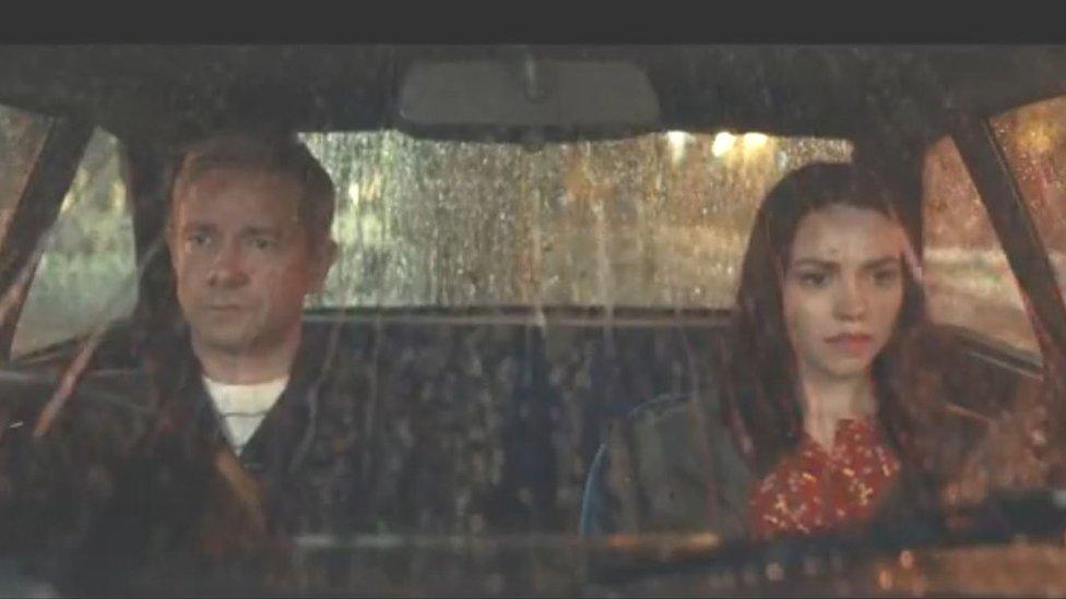 Martin Freeman and a woman sitting in a car during the advert