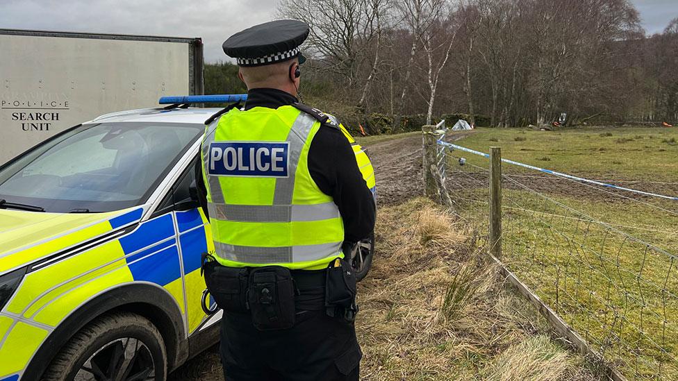 Polcie officer at murder scene