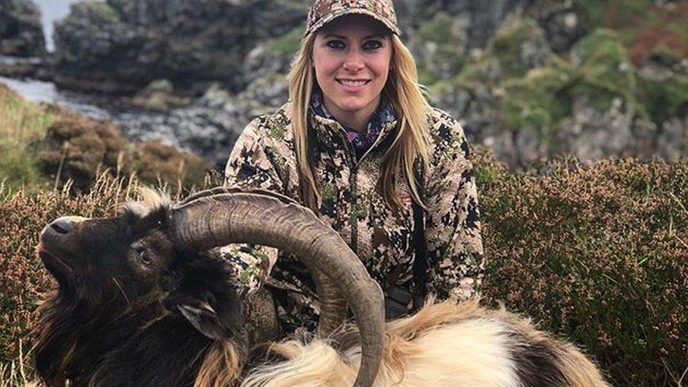 Larysa Switlyk with a dead goat