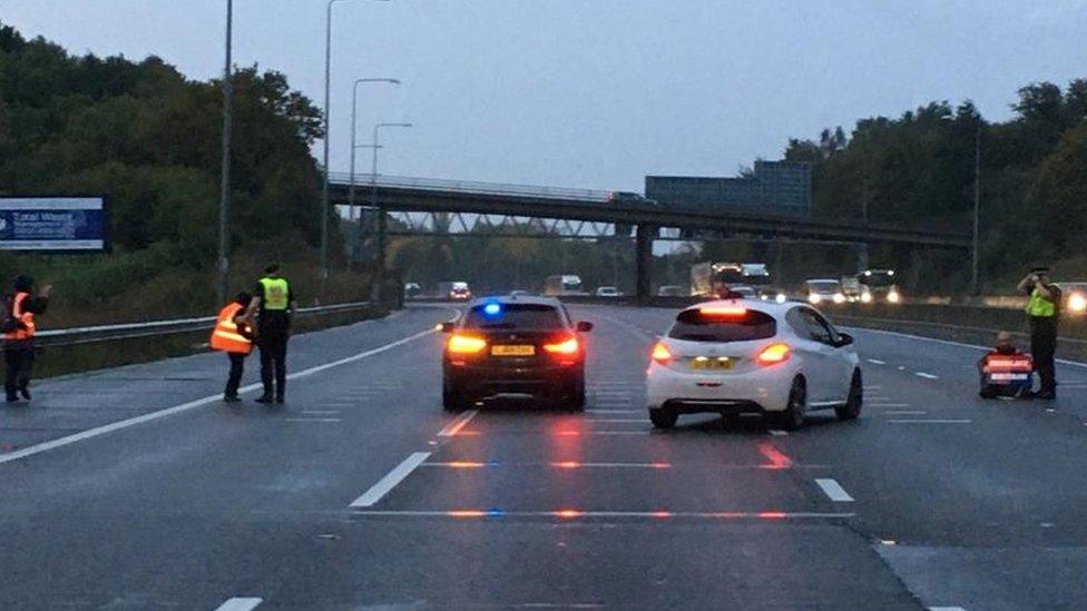 Police on the M25 with Insulate Britain protesters.