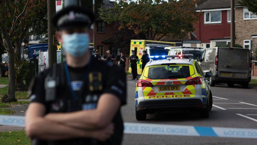 Police officers and ambulance crew attend following the stabbing of UK Conservative MP Sir David Amess