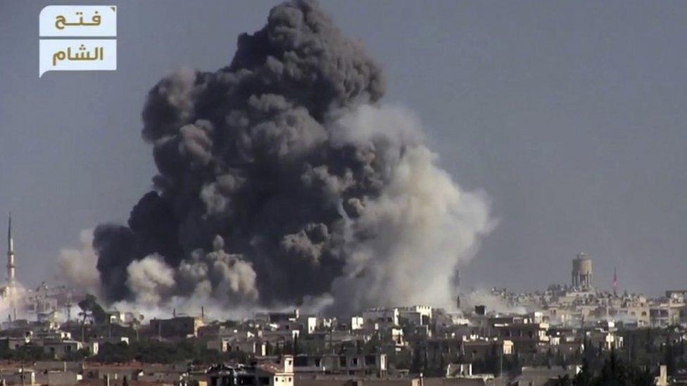 Black smoke rises from a reported suicide bomb attack carried out by rebels against Syrian government forces positions in western Aleppo (03 November 2016)