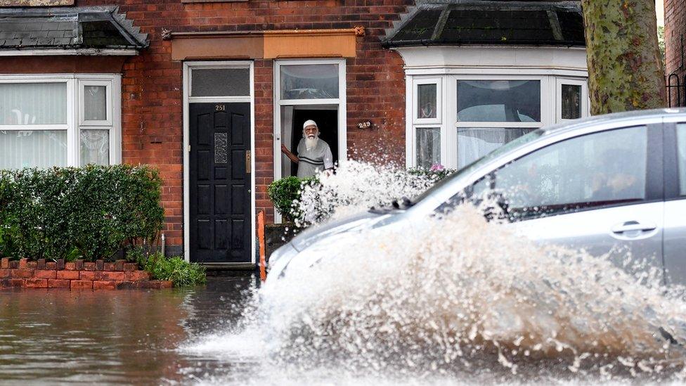 Man-awaits-rescue-from-his-house-in-Birmingham.