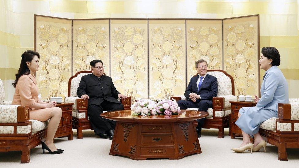 Moon Jae-in (2-R) and his wife Kim Jung-sook (R) chat with North Korean leader Kim Jong-un (2-L) and his wife, Ri Sol-ju (L)