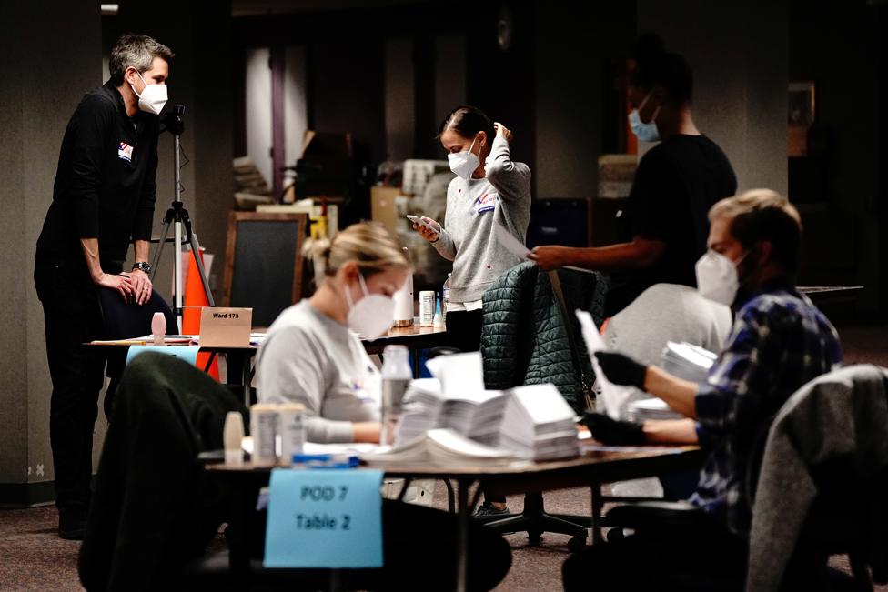 Workers process absentee ballots in Milwaukee, Wisconsin