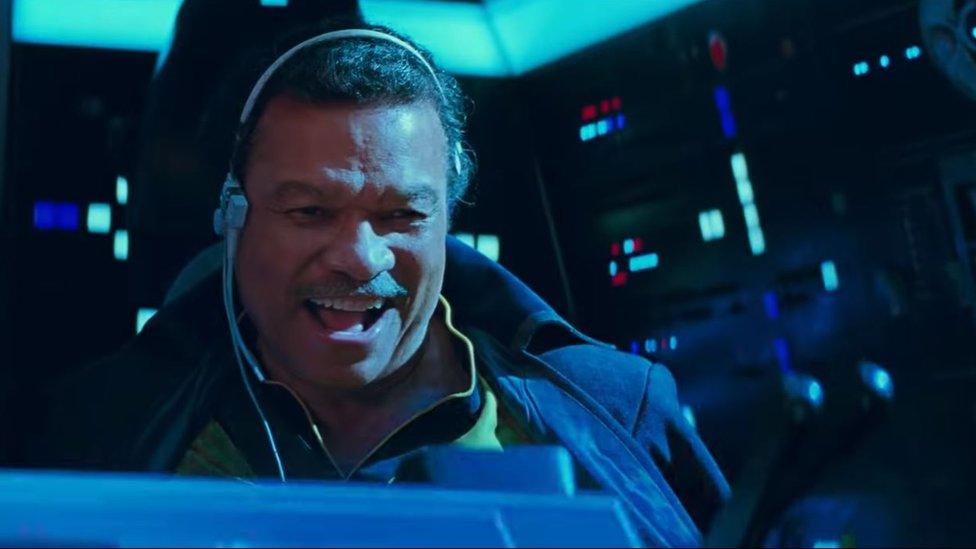 Lando Calrissian piloting the Millennium Falcon